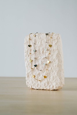 kalp ve boncuk detaylı çelik kolye